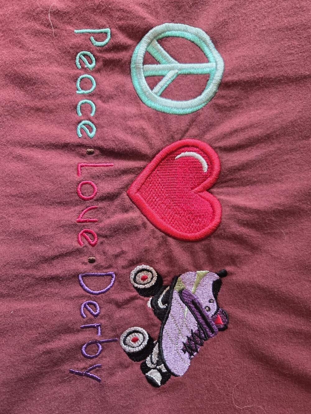 George Maroon Tee with Turquoise Peace, Red Heart & Purple Skate